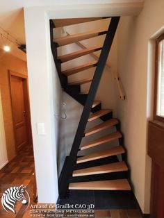 a stair case in the corner of a room with tile flooring and wooden railings