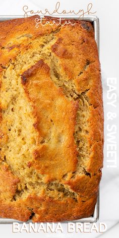 a loaf of banana bread sitting on top of a metal pan with text overlay