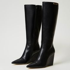 Elevate your style with these chic black pointed-toe mid-calf wedge boots featuring a convenient side zipper. Effortlessly trendy and versatile, perfect for any fashionable ensemble. Color: Black Heel Type: Wedge heel Heel Height: 4'' / 100 mm approx Shaft Height: 13.5'' / 342.9 mm approx Product measurements were taken using size 8. Please note that measurements may vary by size. Toe: Pointed toe Side-zipper design Handcrafted US sizing. Fits true to size Wedge Heel Boots, Black Heel, Wedge Boots, Heel Type, Black Heels, Wedge Heels, Mid Calf, Side Zipper, Heel Height