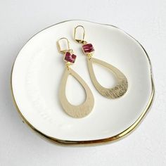 These stunning gold statement earrings are perfect for the holidays with their beautiful burgundy mojave gemstone accents. Let these gold statement earrings elevate your outfit! Gold Statement Earrings, Gold Earrings Dangle, Silver Pieces, Jewelry Case, Ear Jewelry, Stone Pendants, Gold Plating, Gemstone Earrings, Statement Earrings