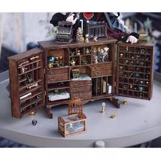 a doll house furniture set with many items on it's shelf and shelves in the middle