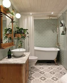 a bath room with a toilet a tub and a sink