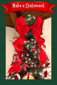 a christmas tree decorated with red bows and ornaments