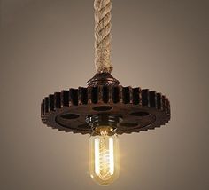 a light that is hanging from the ceiling with a rope on it's end