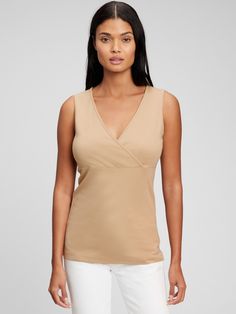 Made with 48% organically grown cotton.  Organic cotton is better for people and the environment because it's grown without the use of harmful synthetic pesticides and fertilizers.  Soft modal-blend jersey.  Crossover V-neck for easy nursing.  Tank straps.  Shirring at empire waist.  Please note: Maternity styles cannot be returned in store.  Please enjoy free returns by mail. Versatile Cotton V-neck Tops, Gap Tops For Spring, Gap V-neck Tops For Spring, Gap V-neck Summer Tops, Spring Organic Cotton Stretch Tops, Fitted Sleeveless Organic Cotton Top, Versatile Cotton V-neck Tank Top, Solid Color Cotton V-neck Tank Top, Solid Cotton V-neck Tank Top