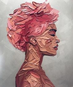 a painting of a woman's head with red hair and paper mache on it