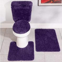 a purple toilet and rug in a bathroom