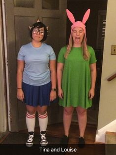 two women in bunny ears are standing next to each other