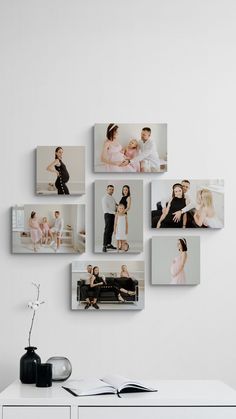 a white wall with many pictures hanging on it