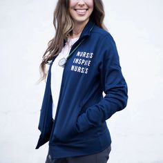 Nurses Inspire Nurses Navy Track Jacket |Nurse Track Jacket | Nurse Jacket | Nurse Shirt | Nurse Work Shirt | Nurse Hospital Jacket | Nurse Long Sleeve Shirt | Nurse Zip Up | Nurse Shop | Nurse Online Shop | Nurse Work Wear | Nurse Wear | Nurse Community | Nurses Inspire Nurses | Nurse Gift | Nurses Week Gift | Nurse Love | Nurse Items Must-Haves Nurse Hospital, Nurses Week Gifts, Symbol Of Strength, Nurse Love, Nurses Week, Fabric Cuff, Nursing Clothes, Nurse Shirt, Nursing Tshirts