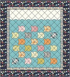 a quilted wall hanging with fish on it