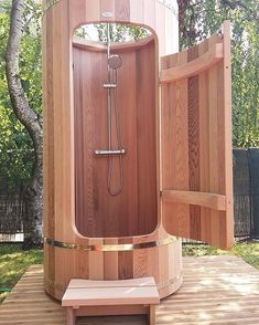 a wooden sauna in the middle of a yard