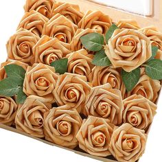 a box filled with lots of brown roses