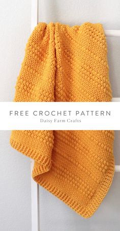 a yellow knitted scarf hanging on a door handle with the words free crochet pattern