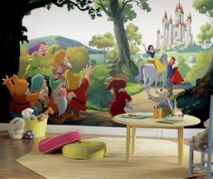 there are many cartoon characters on this wall mural in the children's playroom