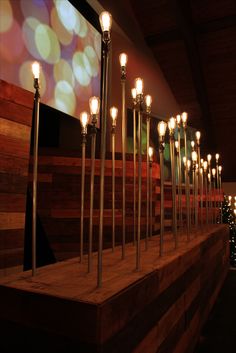 a row of lights sitting on top of a wooden platform