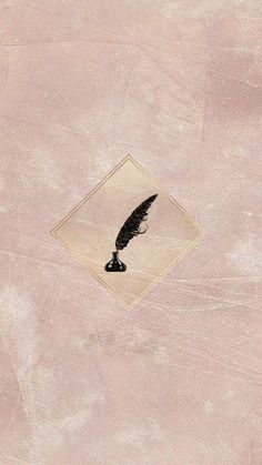 an image of a black feather on a pink background with a diamond in the middle