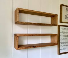 two wooden shelves are hanging on the wall