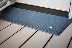 Replace your traditional welcome mat with a TRANSITIONS Angled Entry Mat to welcome guests of all levels of mobility. The mat's gentle incline eliminates pesky door thresholds lips, yet does not interfere with standard access. Simply place the mat in front of the door to provide a smooth, ground-to-sill transition and instantly help reduce trip hazards for aging individuals and mobility device users. EZ-ACCESS 1.17-ft x 40-in Rubber Portable Doorway Wheelchair Ramp in Gray | TAEMSG 1.5-1 Rubber Ramp, Entry Mat, Door Thresholds, Threshold Ramp, Wheelchair Ramp, Entry Mats, Storm Grey, Living Room Update, Mobility Aids