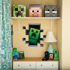 a shelf with some minecraft items on it next to a lamp and window curtain