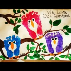 an image of two owls on a tree branch with handprints in the background