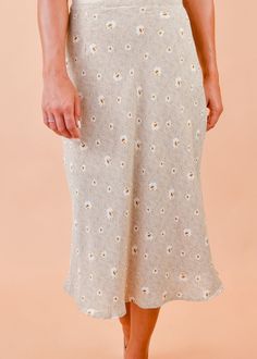 We are loving this fun & flirty midi skirt for any season! A pretty mix of neutral floral shades dance across this flattering, midi cut, woven fabric as it tumbles from a high waist. Pair this pretty piece with a distressed tee, knit, or a lacy cami for a perfect date-night ensemble! Hidden side zipper Lined 100% Polyester, 100% Rayon (lining) True to size Our model Karin is wearing a size Small Apostolic Outfit Ideas, Mission Fits, Midi Skirt Outfits Summer, Feminine Fits, Flora Skirt, Apostolic Outfit, Midi Skirt Fall, Outfit For Church, Skirt Outfit Summer