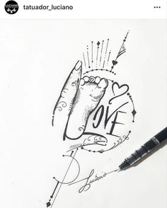 a pen and some writing on a white paper with the words love written in it