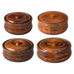 four wooden containers with lids on each side and one has a lid in the middle