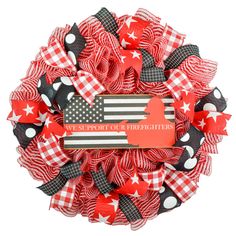 a red and white wreath with an american flag on it, surrounded by black and white polka dots