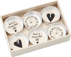 six magnets in a wooden box with words and hearts on the front one says have a lot of love