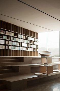 a room with bookshelves and shelves filled with books