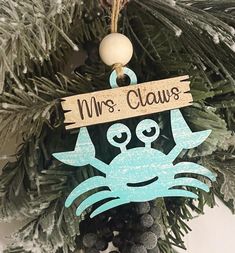 a wooden ornament hanging from a christmas tree