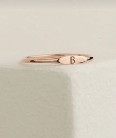 This bronze-plated silver ring features a delicate "B" letter at the tip, offering a personal and unique design. The warm tones of bronze combined with the shine of silver create a stylish accessory perfect for both everyday wear and special occasions. This handmade ring is a thoughtful and meaningful gift option for loved ones. Lightweight and comfortable, it provides ease of wear throughout the day. Ring With Letter, B Letter, Letter B, Stylish Accessories, Meaningful Gifts, Handmade Ring, Personalized Jewelry, Band Rings, Silver Ring