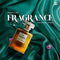 a bottle of perfume sitting on top of a green cloth