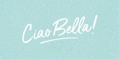 the word cia bella written in white on a light blue background with small speckles