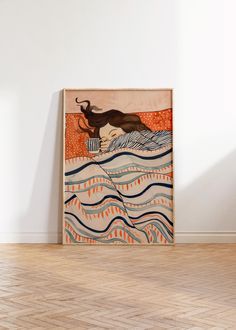 a painting on the wall in an empty room with hard wood flooring and white walls