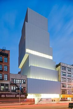 a large white building sitting on the side of a road