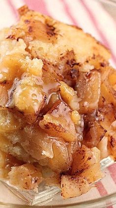 a close up of a piece of food on a plate with a fork and napkin