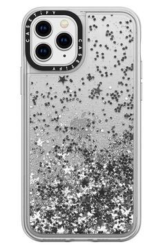 the back of an iphone case with silver glitter and black dots on it, against a white background