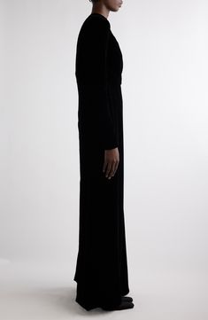 Demna offers a dramatic take on special-occasion dressing with this runway-featured velvet gown that showcases padding at the hips and a floor-skimming cape-inspired detail. 59" length (size 38FR) Hidden back-zip closure Crewneck Long sleeves Partially lined 65% viscose, 35% cupro Dry clean Made in Italy Designer Clothing Luxury Evening Full-length Maxi Dress, Luxury Fitted Velvet Gown, Evening Full Length Gown, Formal Velvet Floor-length Gown, Floor-length Velvet Dress For Gala, Luxury Velvet Floor-length Evening Dress, Luxury Velvet Gown, Black Velvet Evening Maxi Dress, Black Velvet Maxi Dress For Formal Occasions