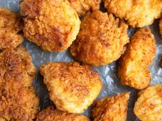 fried chicken nuggets on tin foil lined up