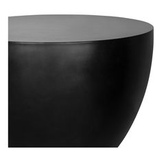 a black round table sitting on top of a white floor