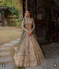 a woman in a bridal gown posing for the camera