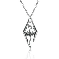 a silver necklace with an intricate design on it