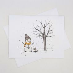 a card with a snowman next to a tree