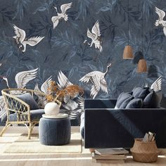 a living room filled with furniture and wallpaper covered in white birds on dark blue background