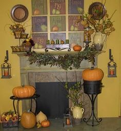 a fireplace decorated for halloween with pumpkins and other decorations