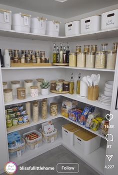 an organized pantry with white bins and containers on the shelves, labeled blissfullifehome follow