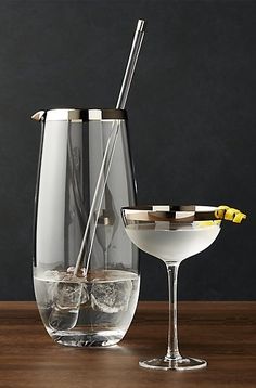 two glasses and a pitcher on a table