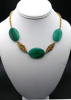 "Vintage gold tone and large green agate necklace ( A ), In good vintage condition. Necklace 18\" long, 2\" Extended. Green agate 1\"3/8 x 7/8 and 5 mm thick. 1\" ¼ x 7/8\" and 5 mm thick. Weighs 1.1 Oz. Thanks." Formal Gold Jade Necklaces, Formal Gold Jade Necklace, Vintage Adjustable Jade Necklace, Adjustable Vintage Jade Necklace, Vintage Adjustable Jade Necklaces, Adjustable Vintage Jade Necklaces, Elegant Gold Beaded Necklaces With Green Onyx, Elegant Gold Beaded Necklace With Green Onyx, Vintage Jade Necklace With Natural Stones